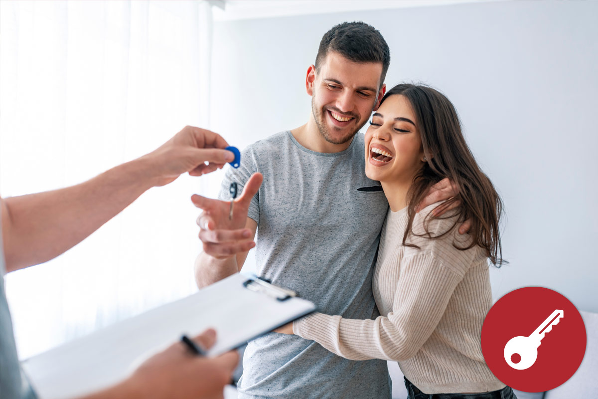 Happy couple accepting keys