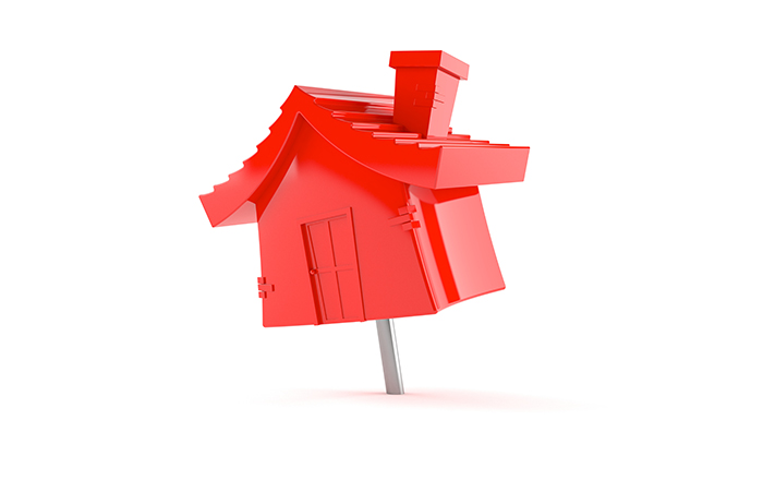 Red house in the shape of a pushpin.