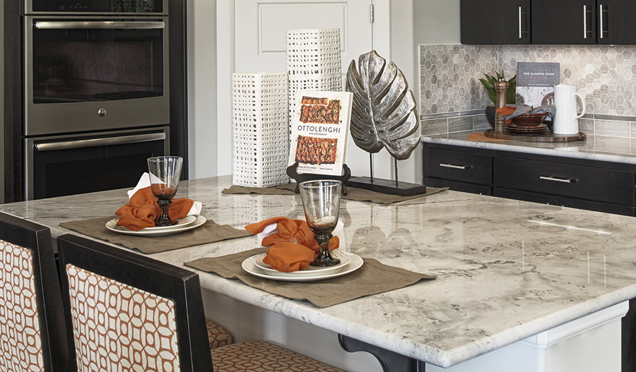 Kitchen with center island in the Alexa floor plan