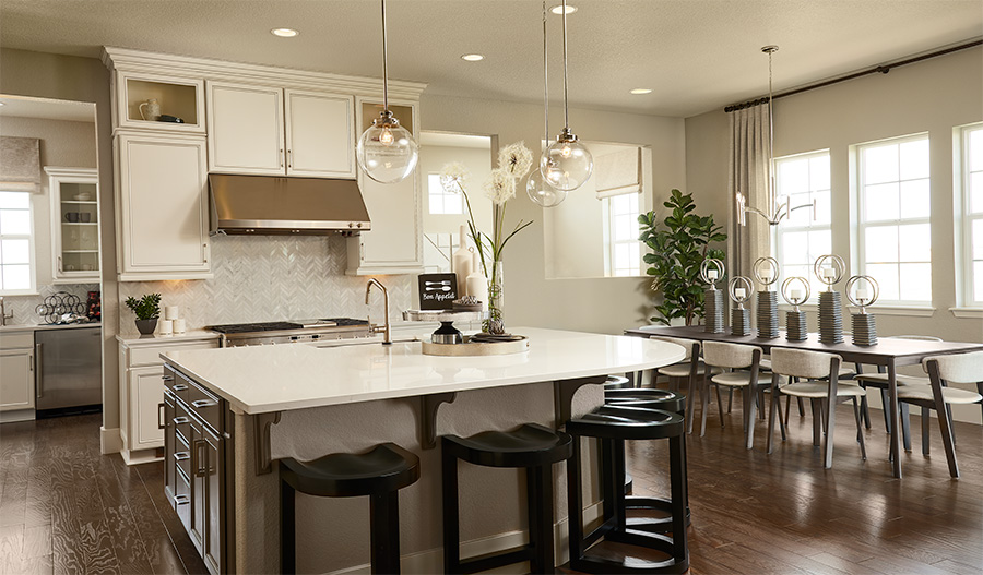 Kitchen and dining room of the Harmon floor plan in Colliers Hill