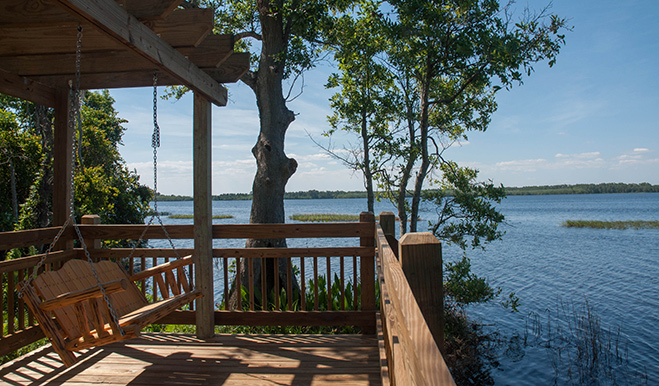 View of a porch swing on Harmony's dock