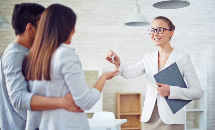 Couple meeting with real estate agent