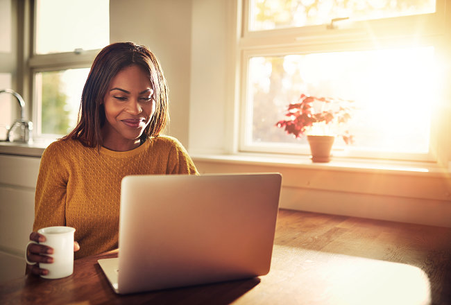 Woman house hunting on laptop