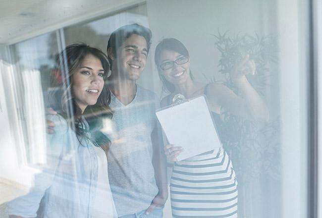 Agent showing home to couple