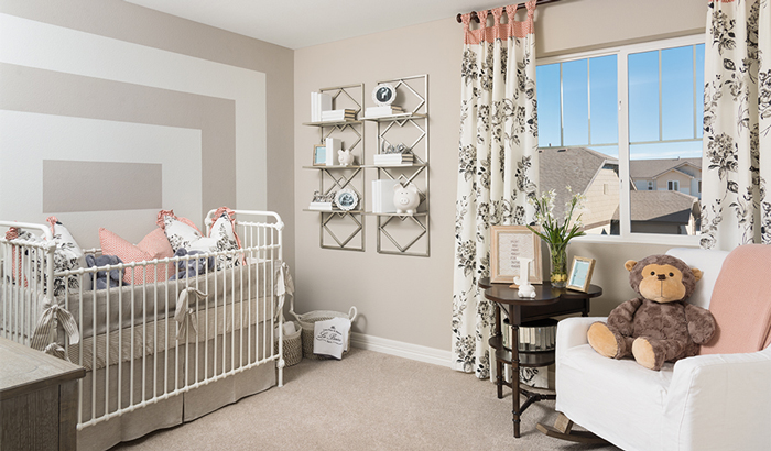 Nursey with white crib and neutral decor