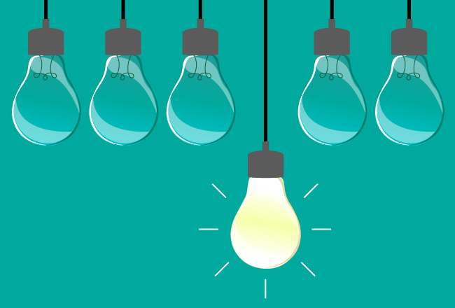 six light bulbs with one lit up
