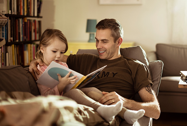 Father reading with daughter