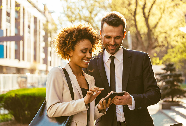 Two people looking at a phone