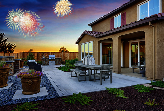 Backyard patio with fireworks in distance