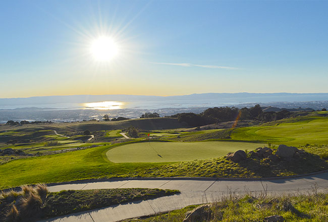 Sun shining on golf course