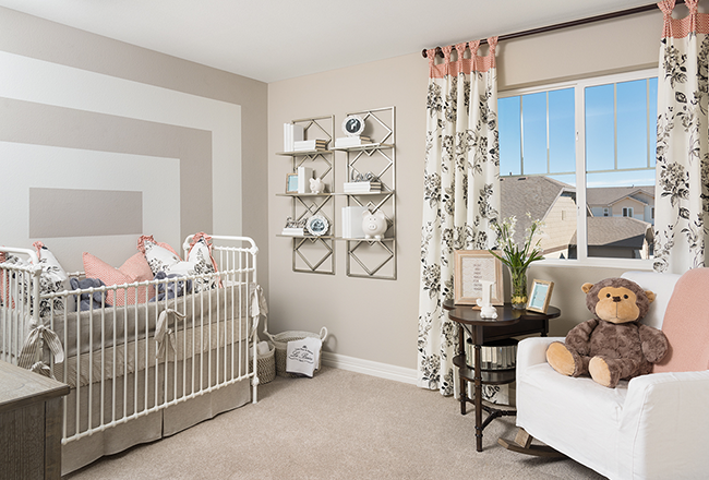 Nursery with white crib and chair