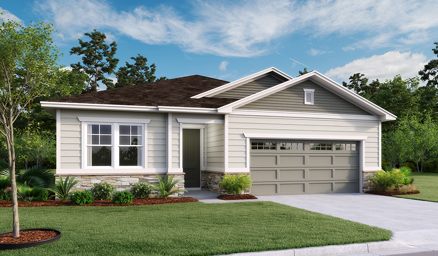 The exterior of a home in Green Cove Springs, FL. 2 car garage with a covered front entry with a large grassy front and side yard