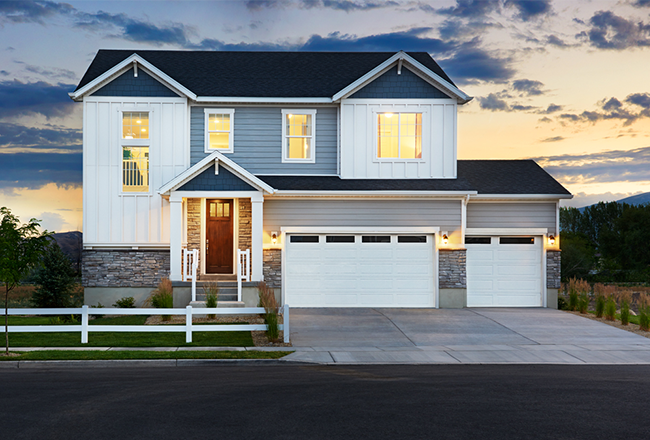 Exterior of two-story Bedford home with 3-car garage