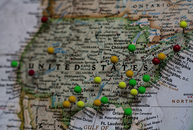 Map of United States with pushpins in certain regions