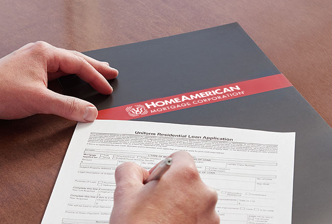 Hand filling out paperwork