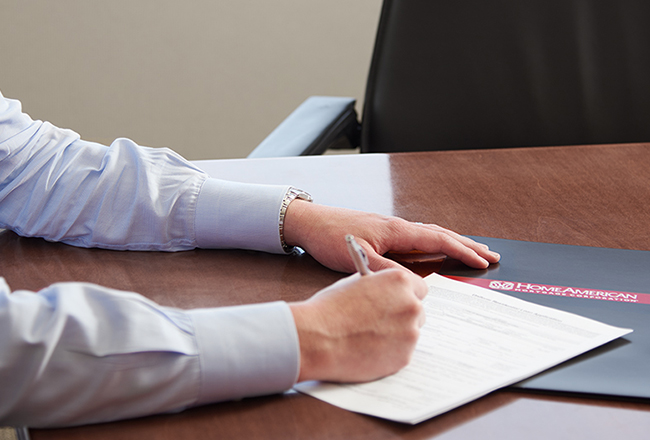 Hands filling out paperwork