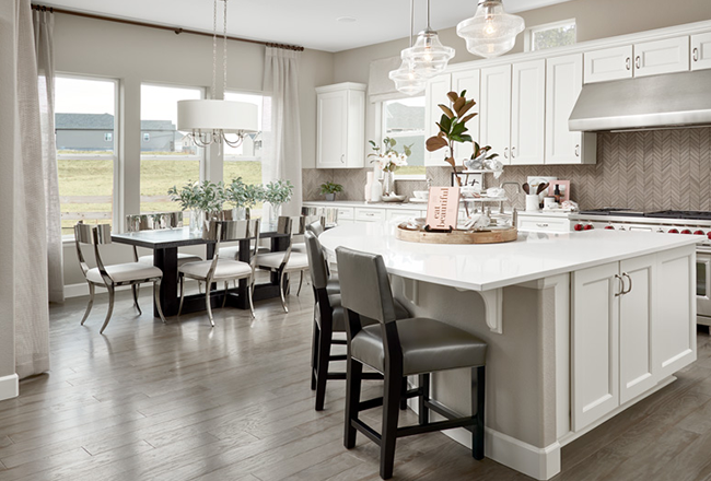 Kitchen with white cabinets and center island