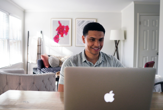 Man reading articles on computer