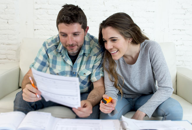 Couple reviewing financial papers