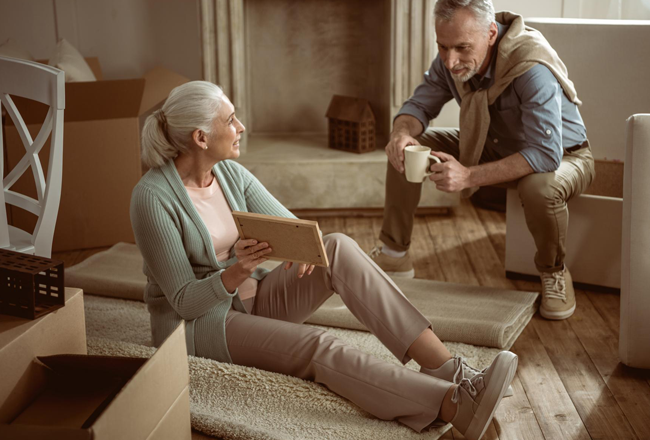 Senior couple with moving boxes