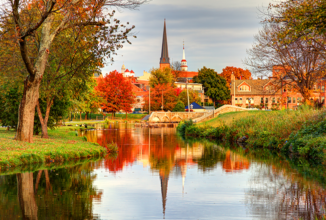 A picturesque river with the town of Brunswick in the background