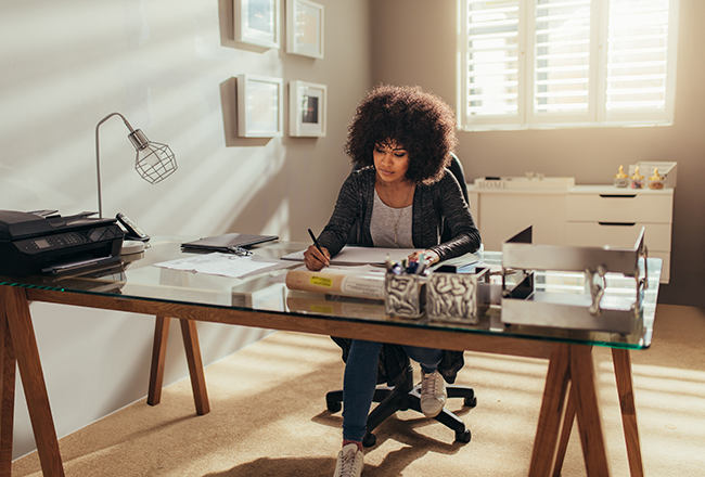 Woman working at desk in home office