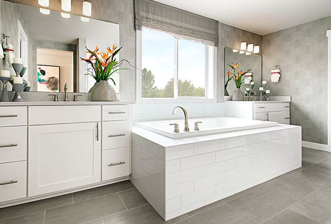 Primary bathroom with white cabinets and soaking tub
