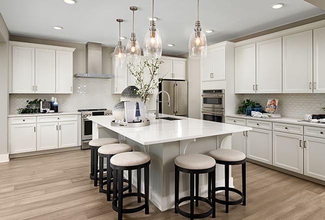 Kitchen with white cabinets and center island