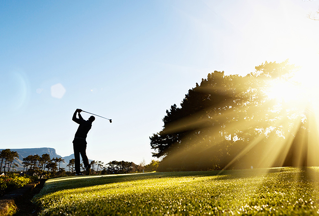 Golfer hitting a tee shot