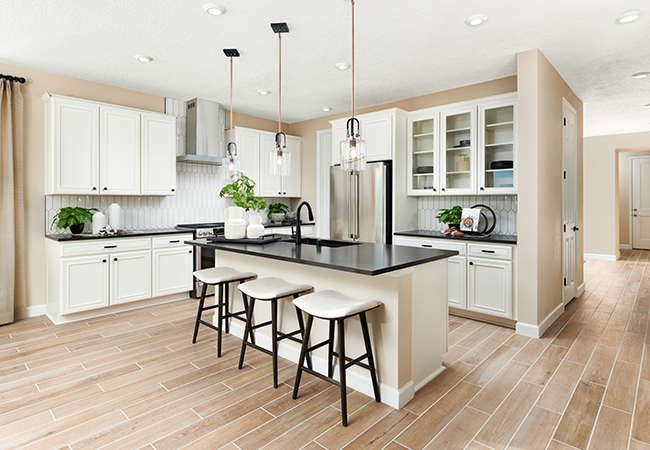 Impressive kitchen with white cabinets and a large center island