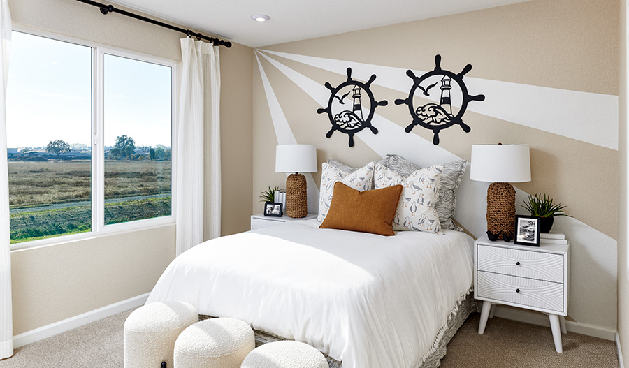 Secondary bedroom with a large window in a Citrine Seasons™ Collection home
