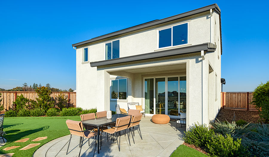 Covered patio with ample seating in a Citrine Seasons™ Collection home