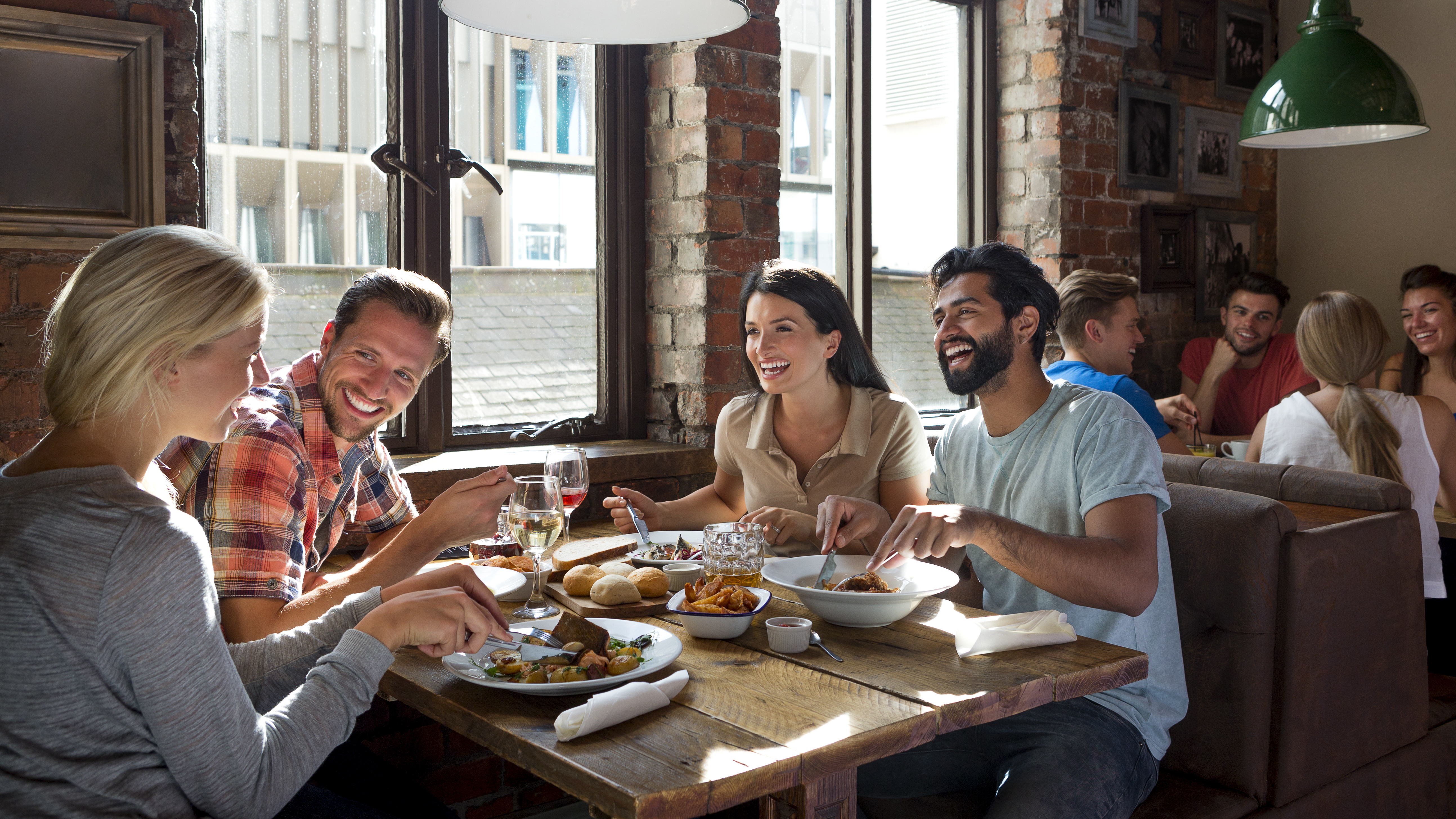 Two couples eating at a restaurant