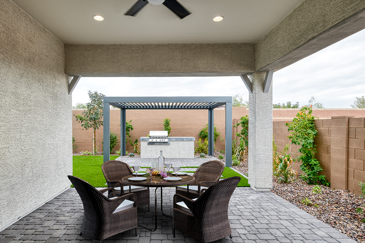 Covered patio in an impressive backyard