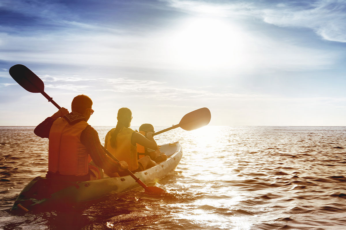 Kayakers on a natural body of water