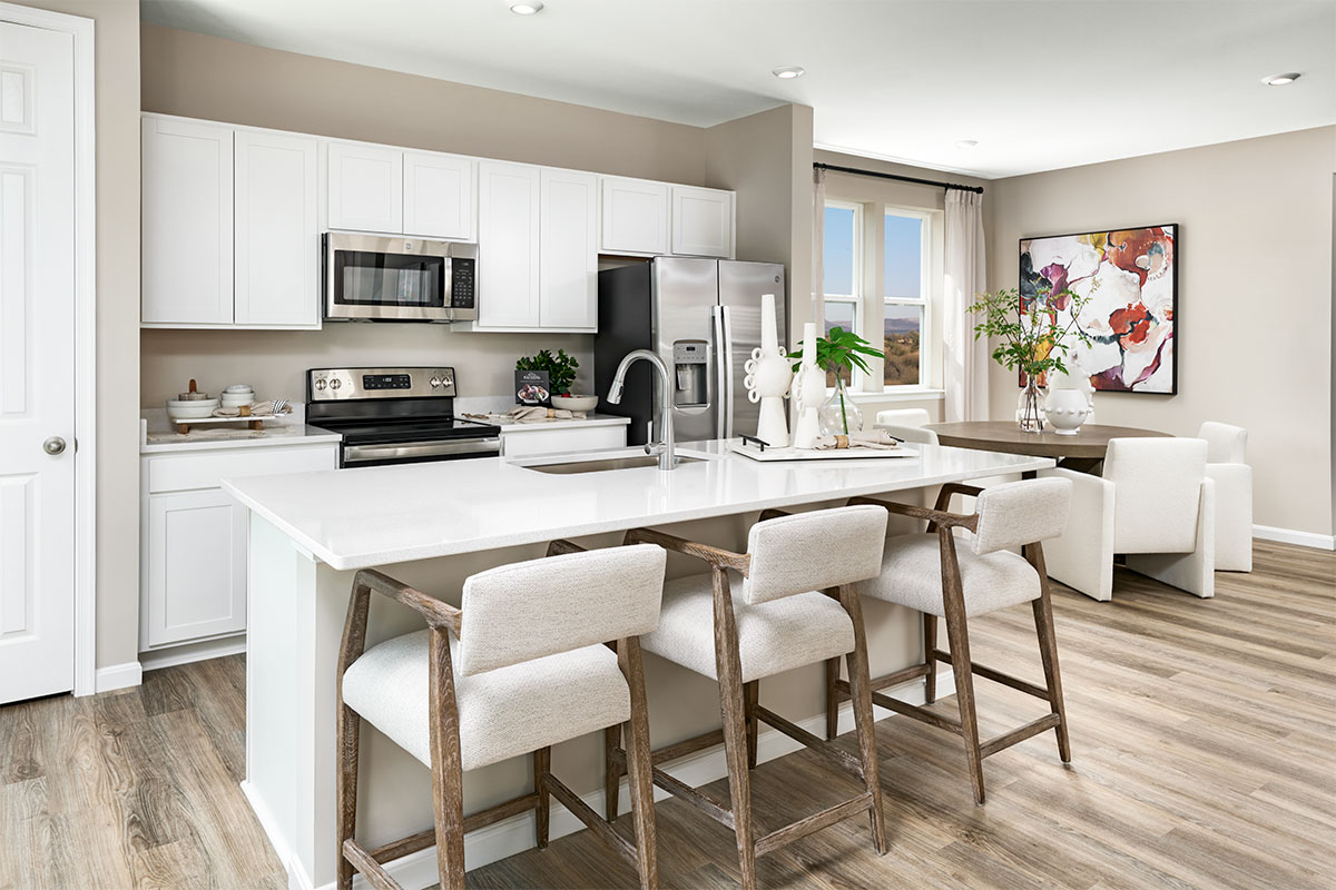 A well-appointed Pearl kitchen with a center island and adjacent dining nook