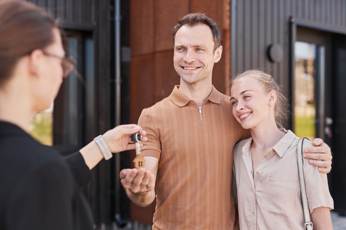 Couple receiving the keys to their new home