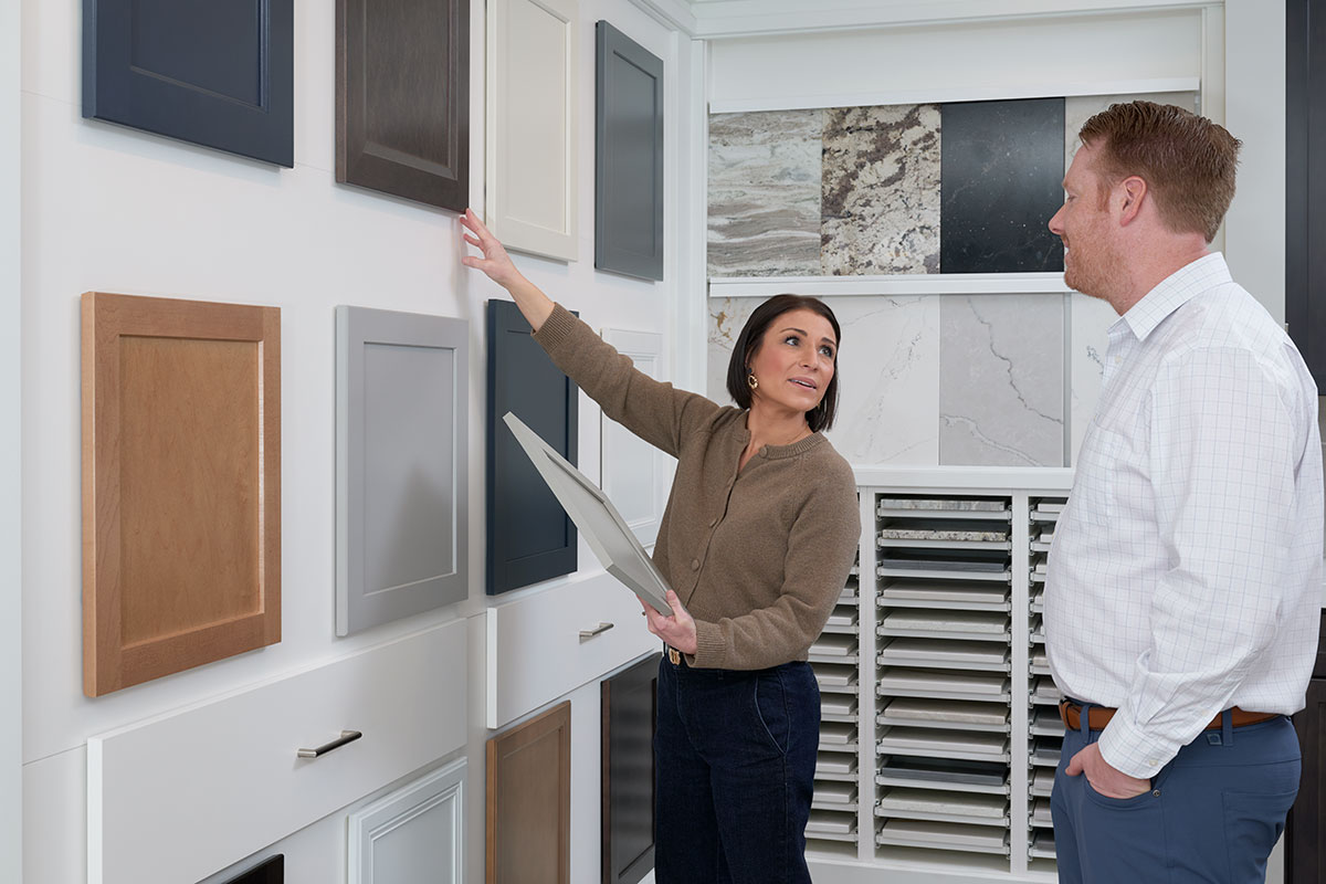 Homebuyers going over cabinetry options in a Richmond American Home Gallery™
