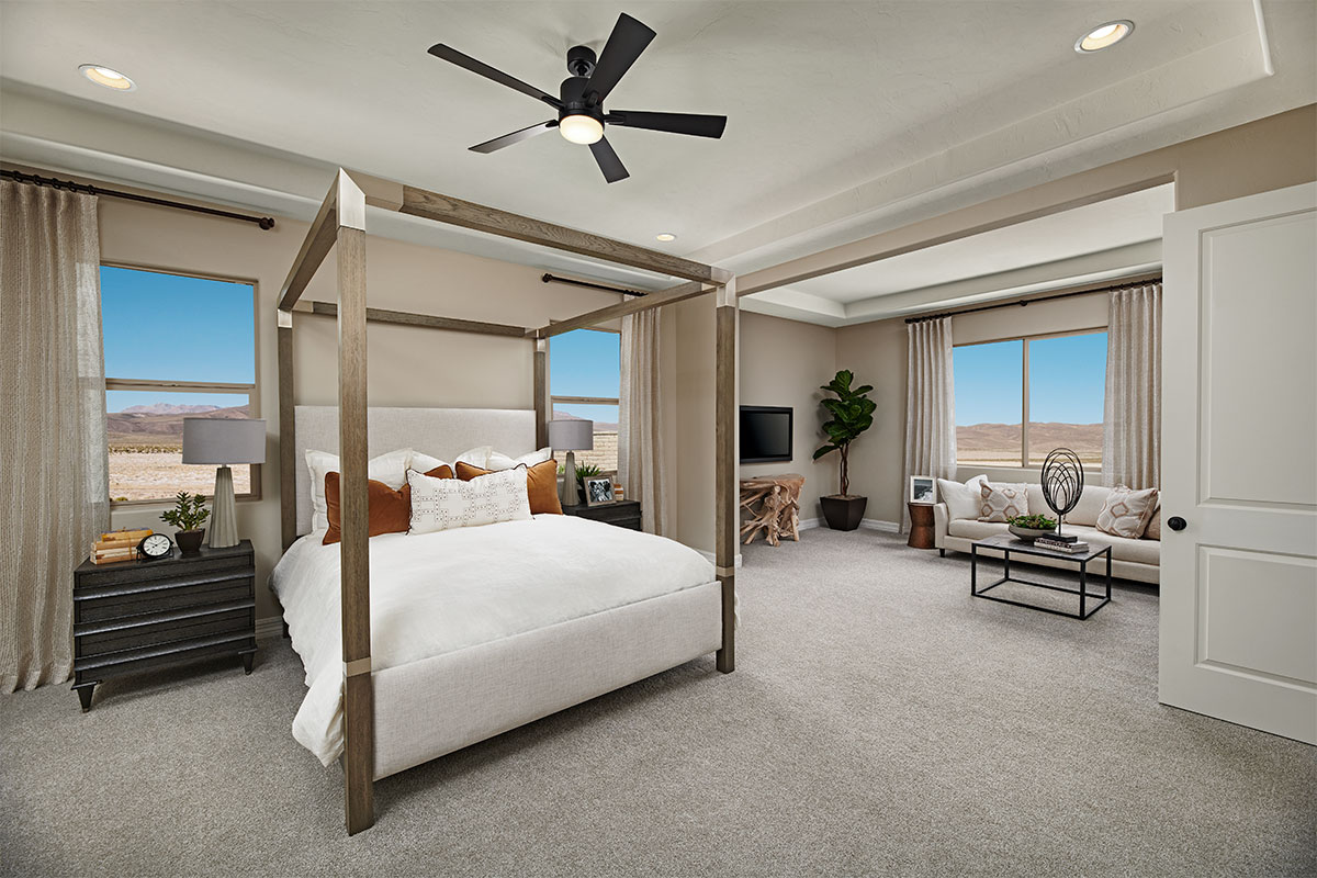 An impressive primary suite with an attached sitting area