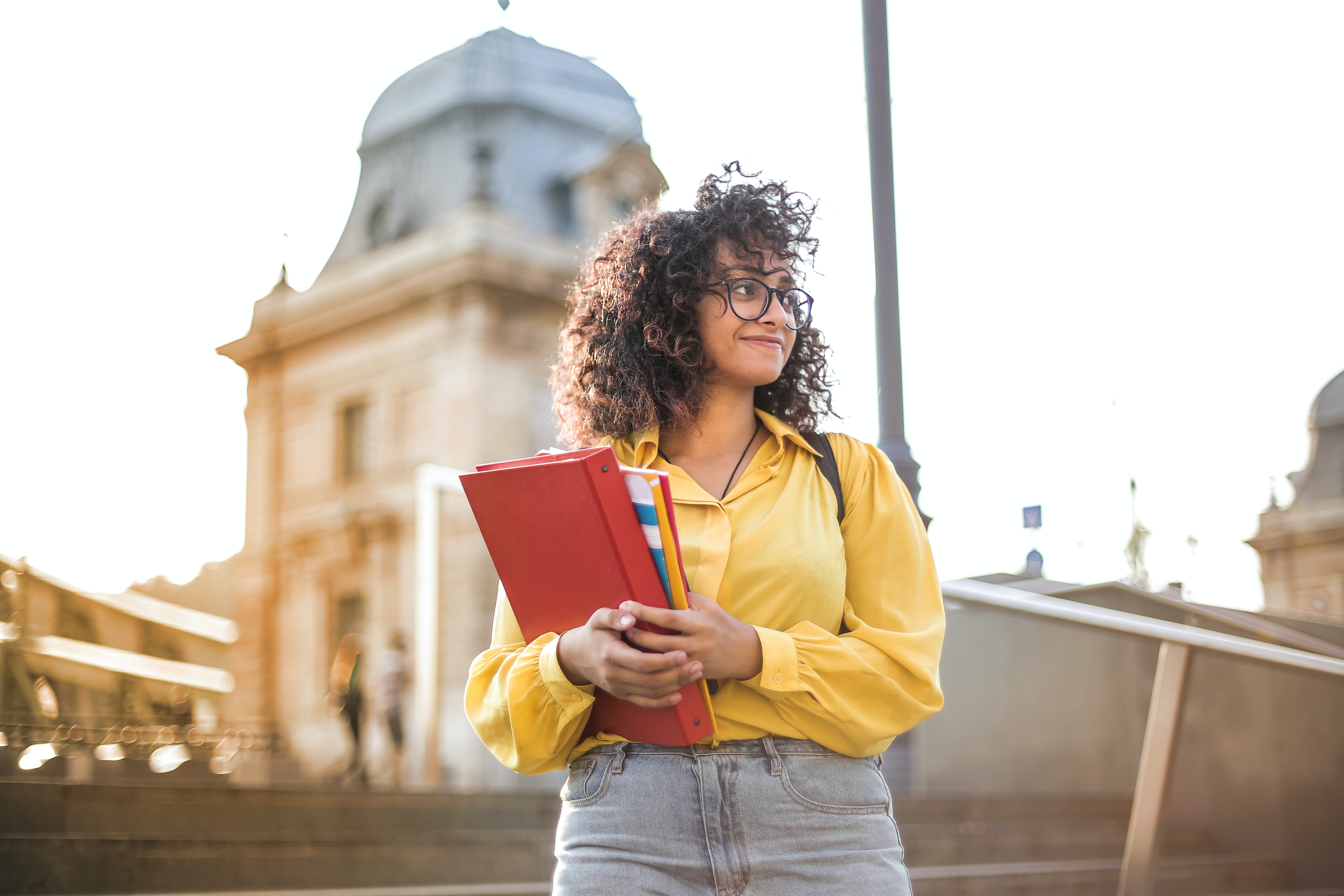 Young academic woman preparing for buying a home with student loans after graduation