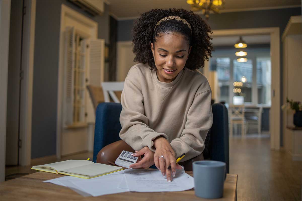 A woman looking over mortgage paperwork