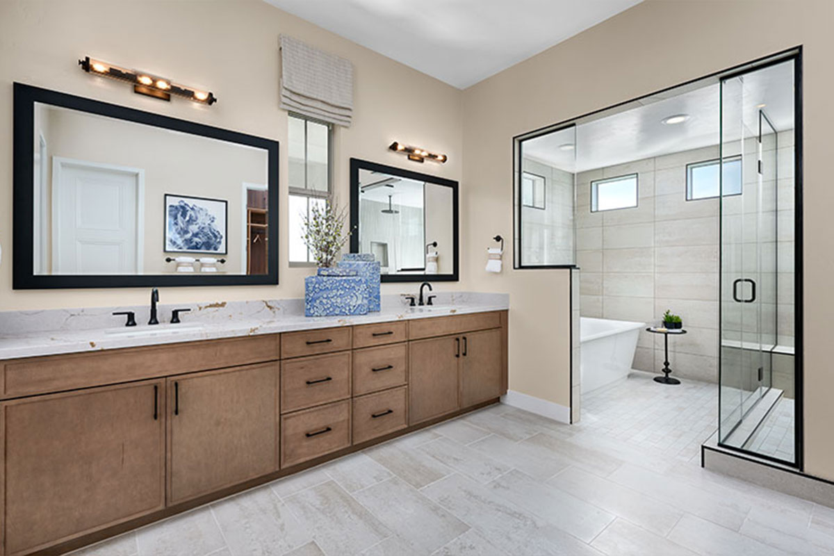 Double sinks and a walk-in shower in a primary bathroom