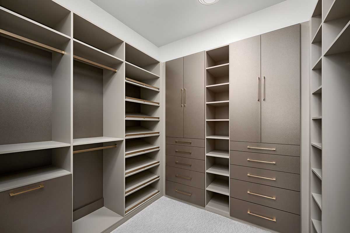 Large closet with cabinets and shelves
