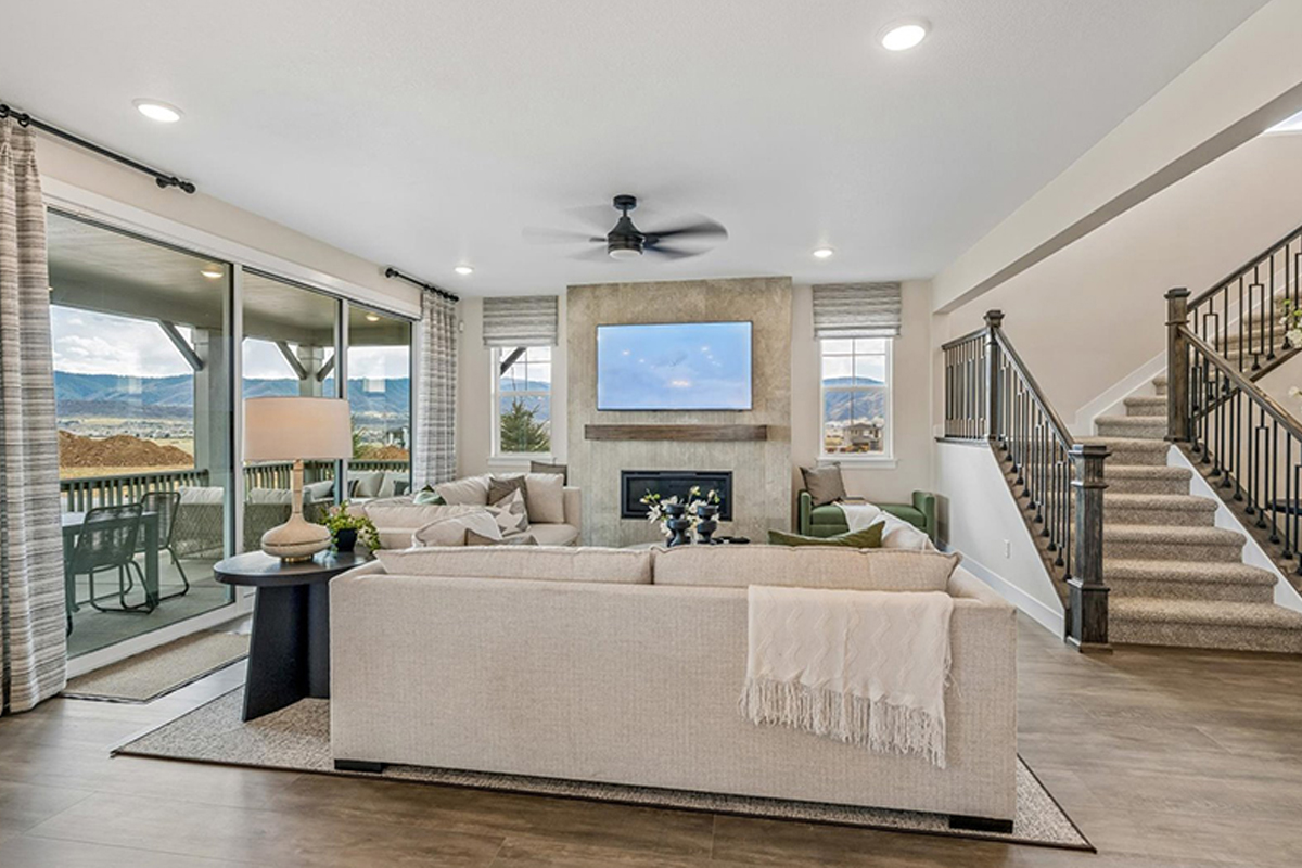 Fully furnished great room with a fireplace