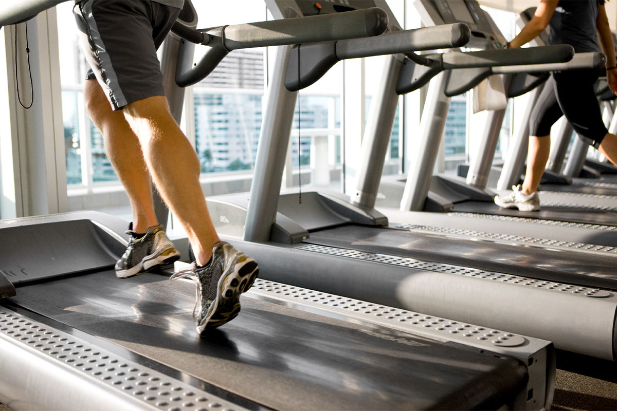 People running on treadmills at a community fitness center