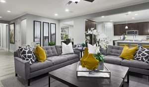 Neutral great room with colorful sofa pillows