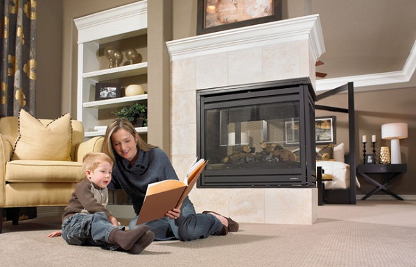 Mother reading to son on floor of owner's retreat with fireplace