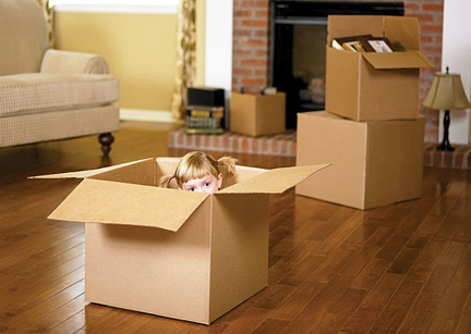 Child hiding in moving box