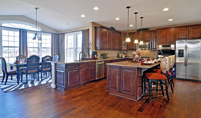 Kitchen with dark cabinets and a center island