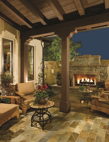 Covered outdoor living space with seating and fireplace